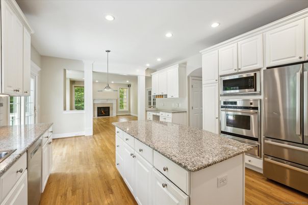Fireplace, Interior, Kitchen, Pendant Lights, Recessed Lighting, Stainless Steel Appliances, Wood Texture Flooring