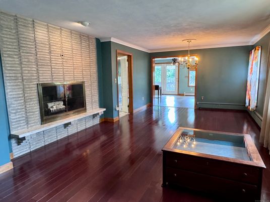Chandelier, Empty room, Fireplace, Interior, Stone Walls, Wood Texture Flooring