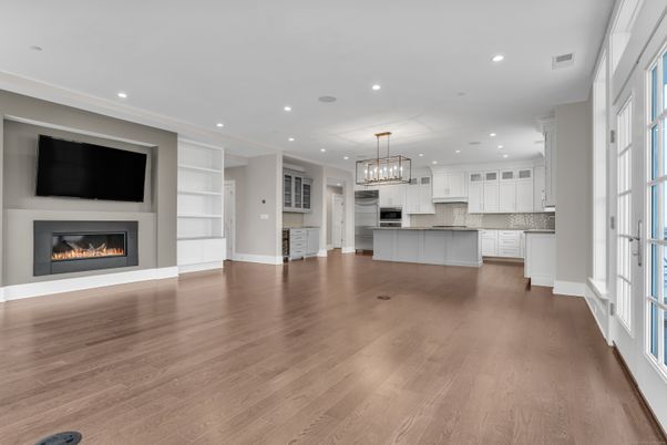 Chandelier, Empty room, Fireplace, Interior, Kitchen, Pendant Lights, Recessed Lighting, Wood Texture Flooring
