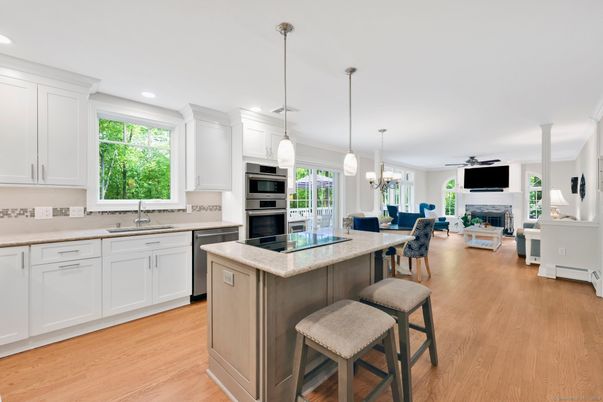 Dining room, Fireplace, Interior, Kitchen, Living room, Pendant Lights, Recessed Lighting, Stainless Steel Appliances, Wood Texture Flooring