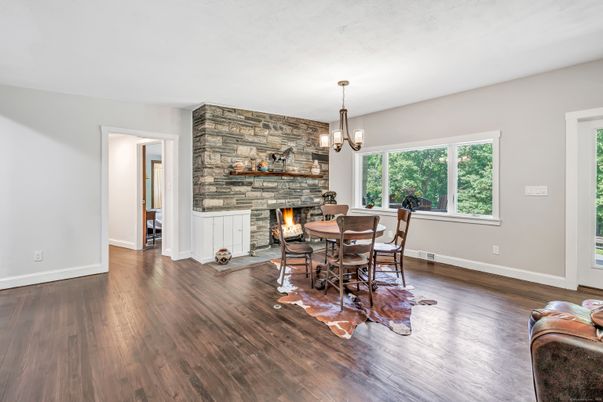 Dining room, Fireplace, Interior, Pendant Lights, Stone Walls, Wood Texture Flooring