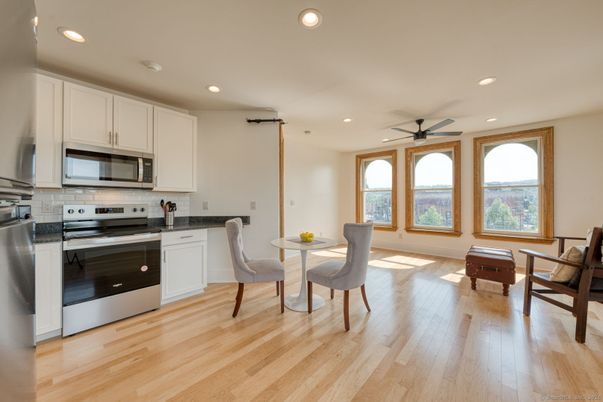 Dining room, Interior, Kitchen, Recessed Lighting, Stainless Steel Appliances, Wood Texture Flooring