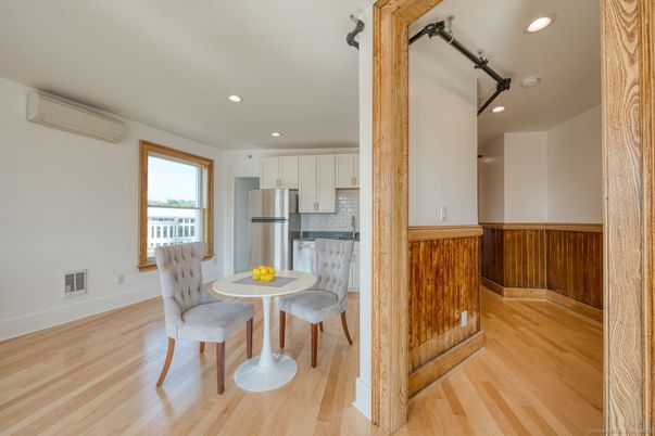 Dining room, Interior, Kitchen, Recessed Lighting, Stainless Steel Appliances, Wood Texture Flooring