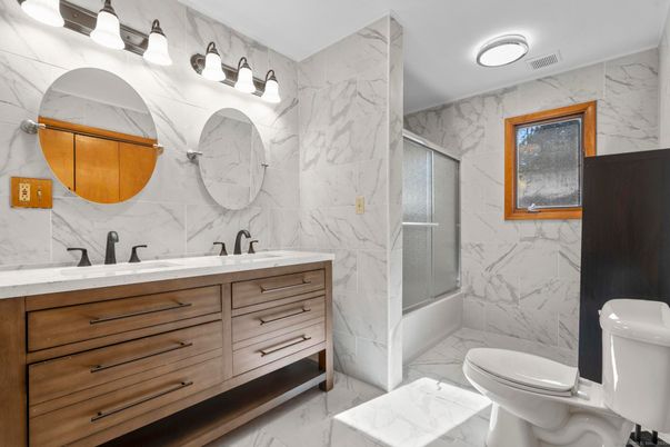 Bathroom, Dual Sink Vanities, Glass Shower, Interior, Marble, Marble Walls