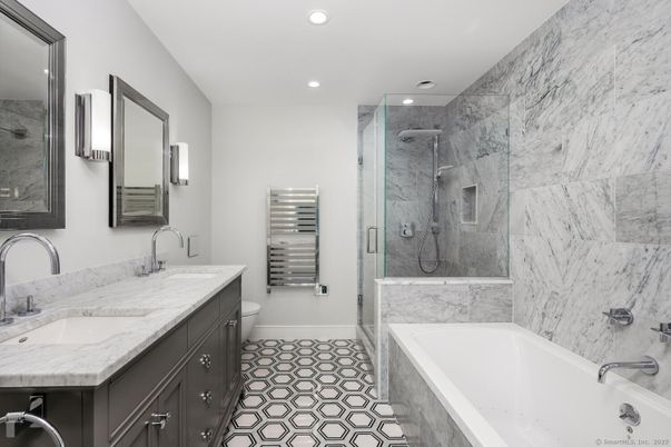 Bathroom, Dual Sink Vanities, Glass Shower, Interior, Marble Walls, Recessed Lighting