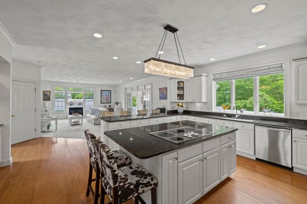 Chandelier, Fireplace, Interior, Kitchen, Living room, Recessed Lighting, Wood Texture Flooring