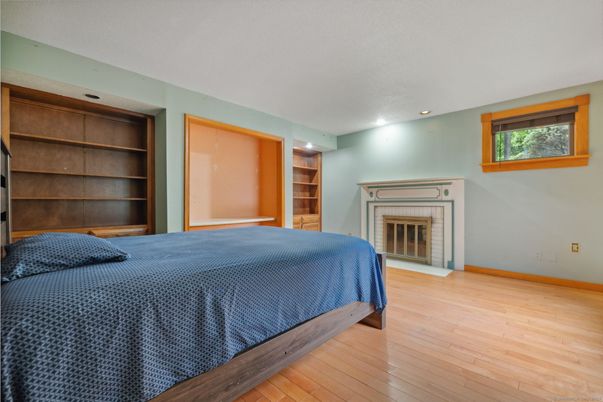 Bedroom, Fireplace, Interior, Recessed Lighting, Wood Texture Flooring