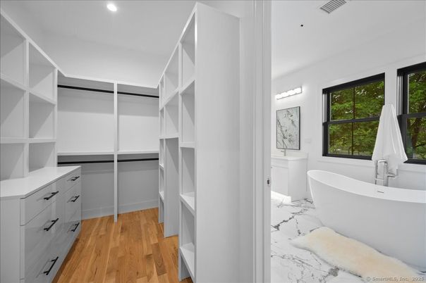 Bathroom, Free Standing Baths, Interior, Marble, Recessed Lighting, Walk-in Closets, Wood Texture Flooring