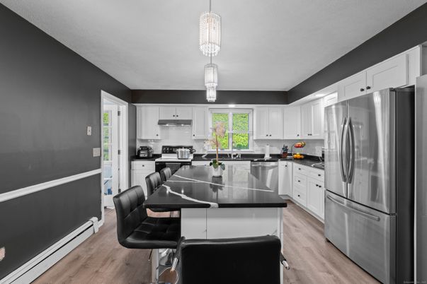 Dining room, Interior, Kitchen, Pendant Lights, Stainless Steel Appliances, Wood Texture Flooring