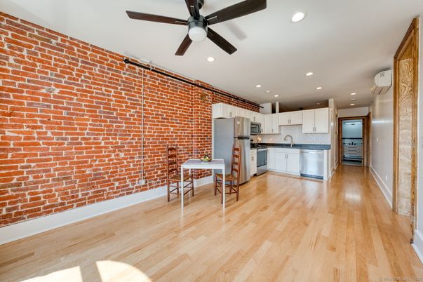 Interior, Kitchen, Recessed Lighting, Stainless Steel Appliances, Stone Walls, Wood Texture Flooring
