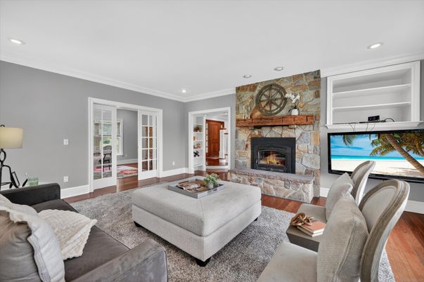 Fireplace, Interior, Living room, Recessed Lighting, Stone Walls, Wood Texture Flooring