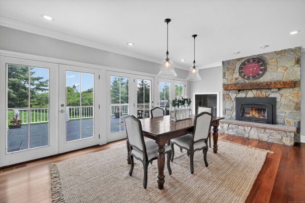 Dining room, Fireplace, Interior, Pendant Lights, Recessed Lighting, Stone Walls, Wood Texture Flooring