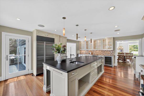 Chandelier, Dining room, Interior, Kitchen, Pendant Lights, Recessed Lighting, Stainless Steel Appliances, Wood Texture Flooring