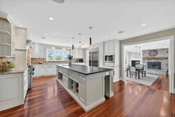 Dining room, Fireplace, Interior, Kitchen, Pendant Lights, Recessed Lighting, Stainless Steel Appliances, Wood Texture Flooring