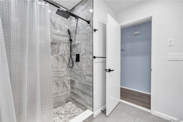 Bathroom, Glass Shower, Interior, Marble Walls, Recessed Lighting, Wood Texture Flooring