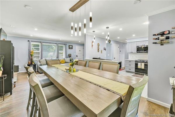 Dining room, Interior, Kitchen, Living room, Pendant Lights, Recessed Lighting, Stainless Steel Appliances, Wood Texture Flooring
