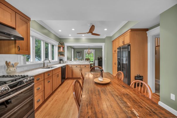 Chandelier, Dining room, Interior, Kitchen, Recessed Lighting, Stainless Steel Appliances, Wood Texture Flooring