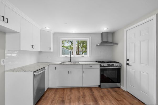 Interior, Kitchen, Recessed Lighting, Stainless Steel Appliances, Wood Texture Flooring