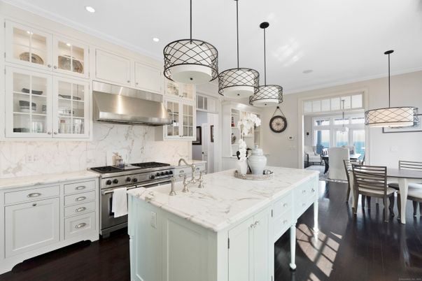 Dining room, Interior, Kitchen, Marble Walls, Pendant Lights, Recessed Lighting, Stainless Steel Appliances, Wood Texture Flooring