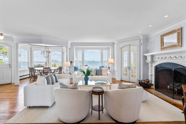 Chandelier, Dining room, Fireplace, Interior, Living room, Recessed Lighting, Water, Wood Texture Flooring