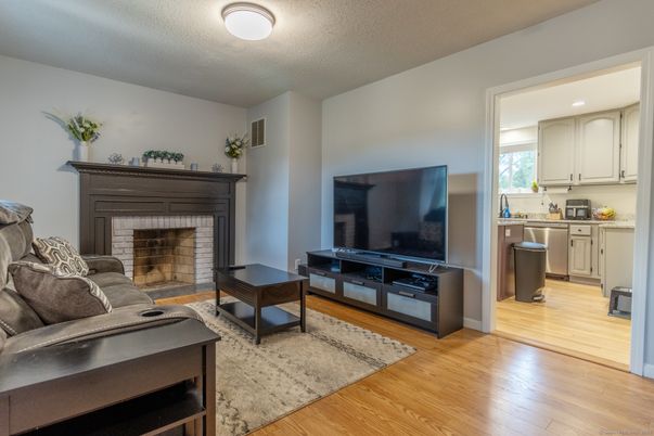 Fireplace, Interior, Kitchen, Living room, Recessed Lighting, Wood Texture Flooring