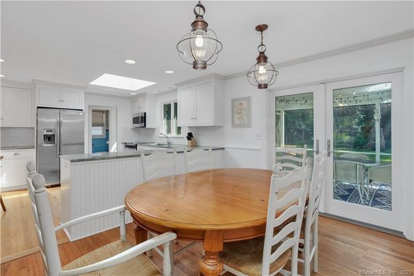 Dining room, Interior, Kitchen, Pendant Lights, Recessed Lighting, Stainless Steel Appliances, Wood Texture Flooring