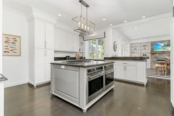 Interior, Kitchen, Pendant Lights, Recessed Lighting, Stainless Steel Appliances, Stone Walls, Wood Texture Flooring