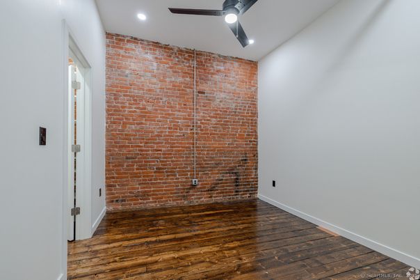 Empty room, Interior, Recessed Lighting, Stone Walls, Wood Texture Flooring