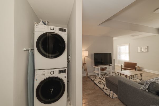 Interior, Living room, Utility Closets, Washer, Wood Texture Flooring
