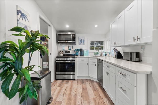 Interior, Kitchen, Recessed Lighting, Stainless Steel Appliances, Wood Texture Flooring