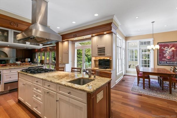 Chandelier, Dining room, Interior, Kitchen, Pendant Lights, Recessed Lighting, Stainless Steel Appliances, Wood Texture Flooring