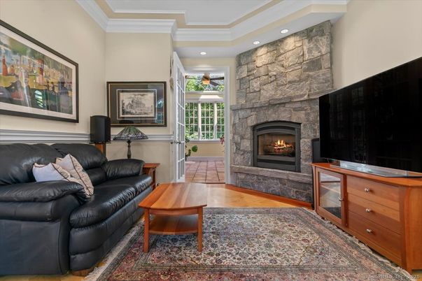 Fireplace, Interior, Living room, Recessed Lighting, Stone Walls, Wood Texture Flooring