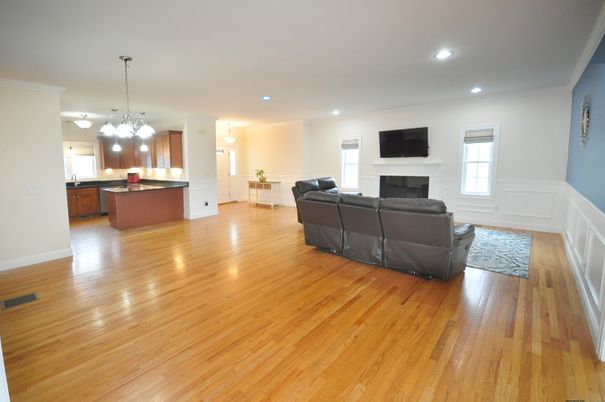 Chandelier, Fireplace, Interior, Kitchen, Living room, Pendant Lights, Recessed Lighting, Wood Texture Flooring