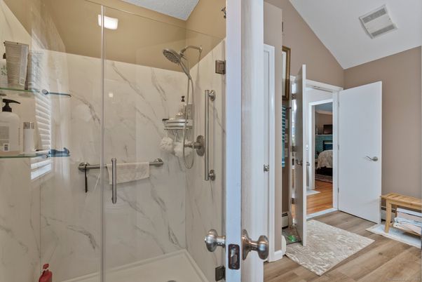 Bathroom, Glass Shower, Interior, Marble Walls, Recessed Lighting, Wood Texture Flooring