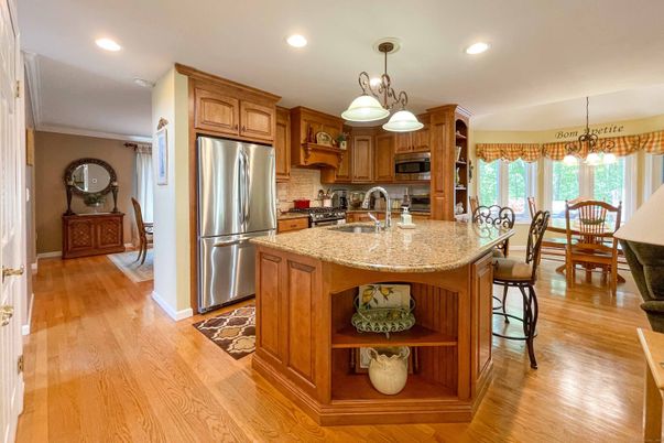 Dining room, Interior, Kitchen, Pendant Lights, Recessed Lighting, Stainless Steel Appliances, Wood Texture Flooring