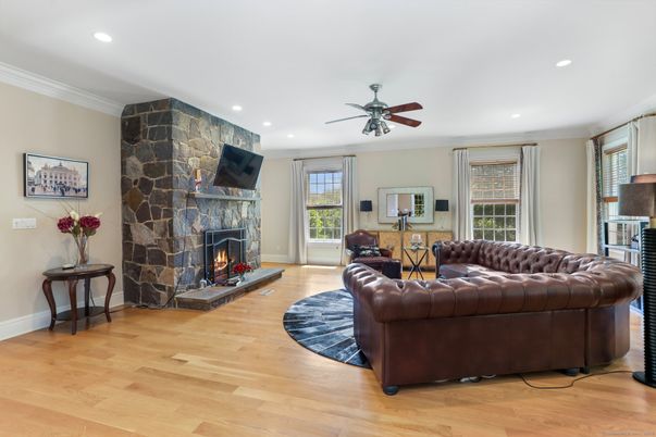 Fireplace, Interior, Living room, Recessed Lighting, Stone Walls, Wood Texture Flooring