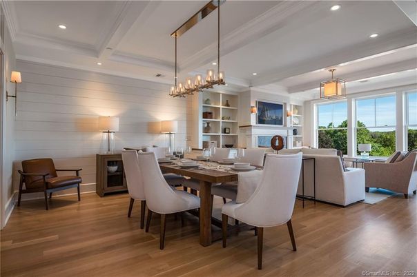 Chandelier, Dining room, Fireplace, Interior, Living room, Pendant Lights, Recessed Lighting, Wood Texture Flooring