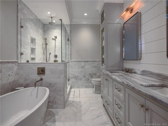 Bathroom, Dual Sink Vanities, Free Standing Baths, Glass Shower, Interior, Marble, Marble Walls, Recessed Lighting