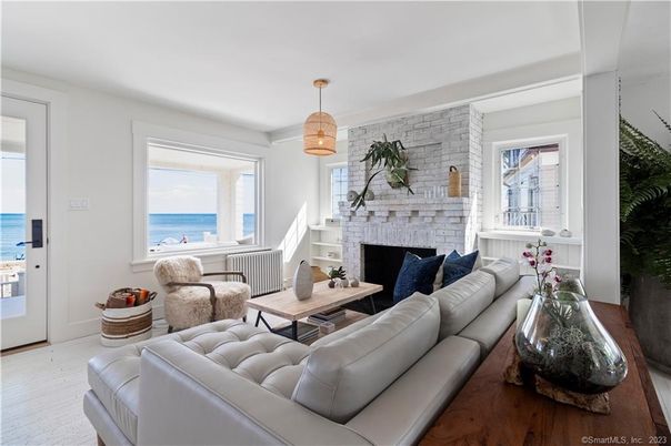 Fireplace, Interior, Living room, Pendant Lights, Stone Walls, Water, Wood Texture Flooring