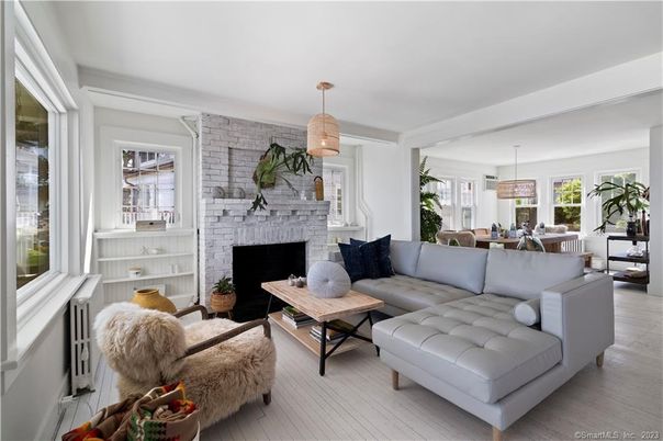 Dining room, Fireplace, Interior, Living room, Pendant Lights, Stone Walls, Wood Texture Flooring