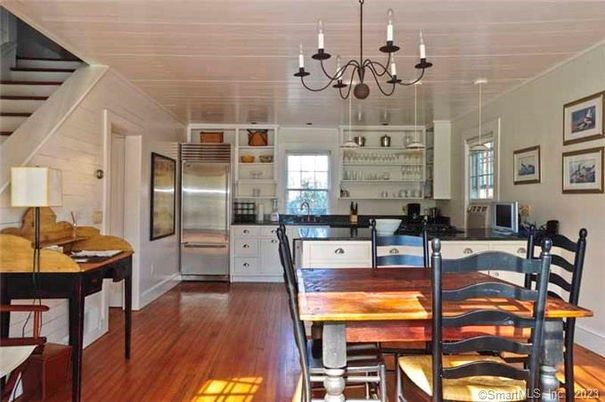 Chandelier, Dining room, Interior, Kitchen, Stainless Steel Appliances, Wood Texture Flooring