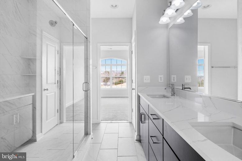Bathroom, Dual Sink Vanities, Glass Shower, Interior, Marble, Marble Walls, Recessed Lighting