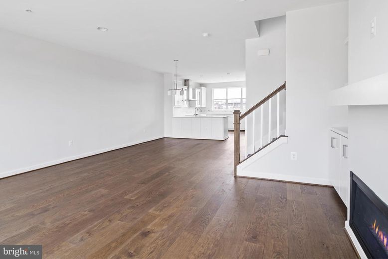 Empty room, Fireplace, Interior, Kitchen, Pendant Lights, Recessed Lighting, Wood Texture Flooring
