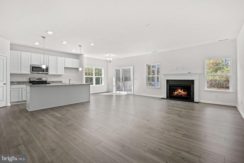 Empty room, Fireplace, Interior, Kitchen, Pendant Lights, Recessed Lighting, Wood Texture Flooring
