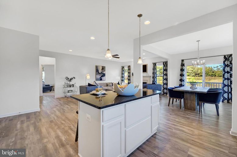Dining room, Fireplace, Interior, Living room, Pendant Lights, Recessed Lighting, Wood Texture Flooring