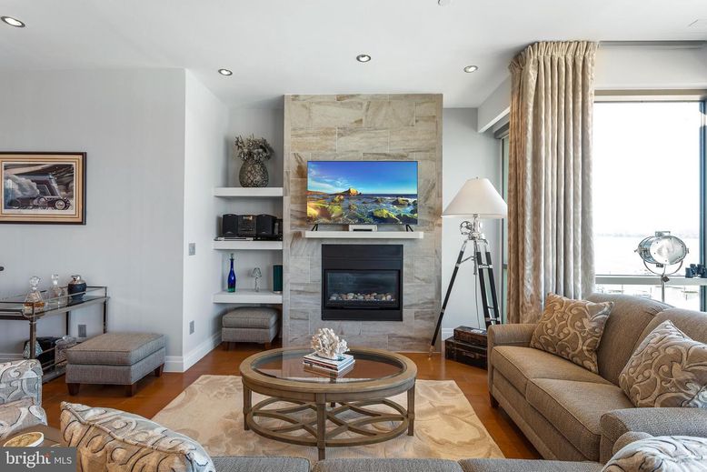 Fireplace, Interior, Living room, Recessed Lighting, Stone Walls, Wood Texture Flooring