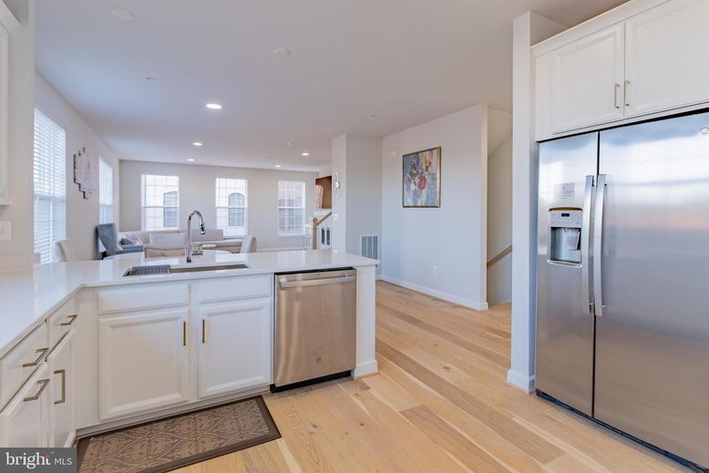 Dining room, Interior, Kitchen, Recessed Lighting, Stainless Steel Appliances, Wood Texture Flooring