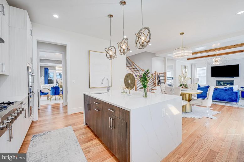 Chandelier, Dining room, Fireplace, Interior, Kitchen, Living room, Pendant Lights, Recessed Lighting, Wood Texture Flooring