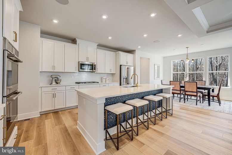 Dining room, Interior, Kitchen, Pendant Lights, Recessed Lighting, Stainless Steel Appliances, Wood Texture Flooring