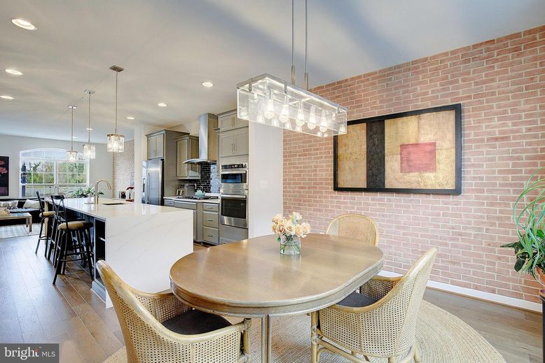 Dining room, Interior, Kitchen, Pendant Lights, Recessed Lighting, Stainless Steel Appliances, Stone Walls, Wood Texture Flooring